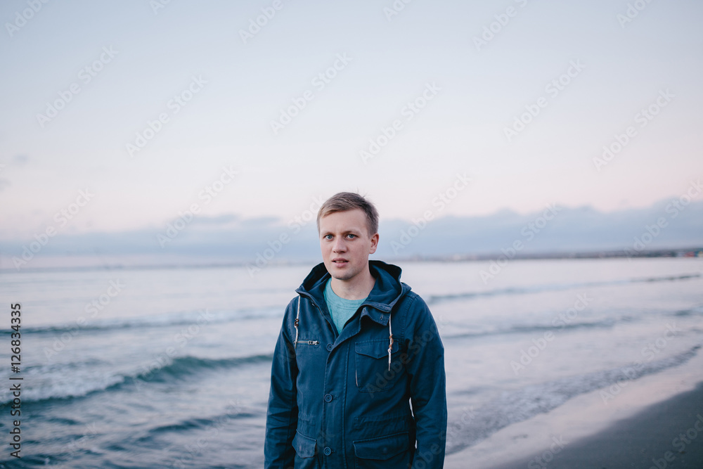 portrait of a young man on the beach portrait of a young man on the beach