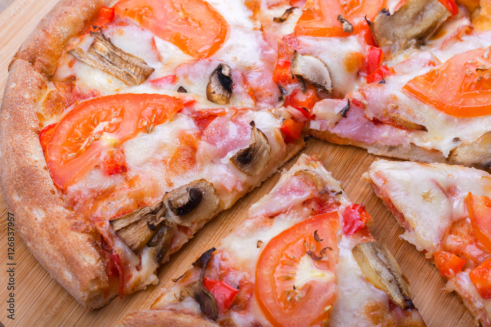Italian pizza on a wooden background