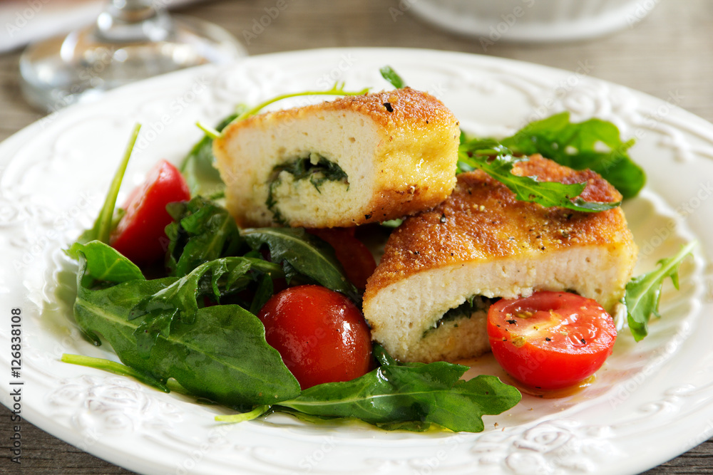 Chicken cutlet with a salad with arugula Chicken cutlet with a salad with arugula
