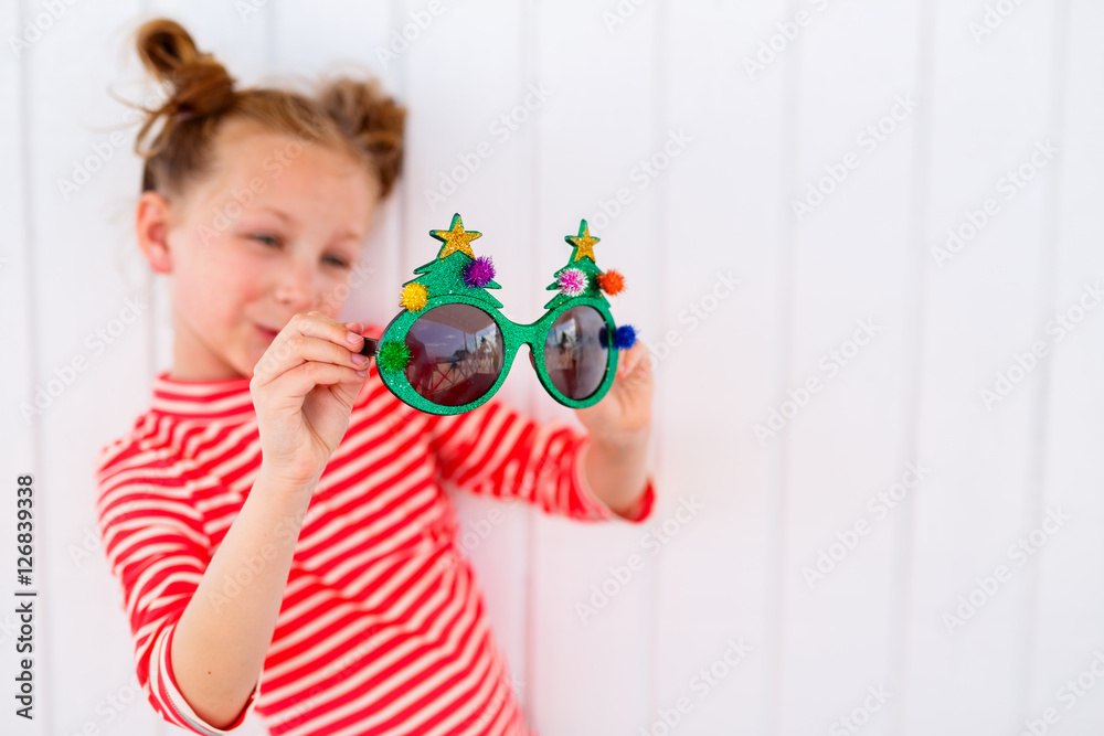 Little girl in funny Christmas glasses Little girl in funny Christmas glasses