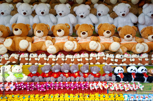 a lot of soft toys on the counter