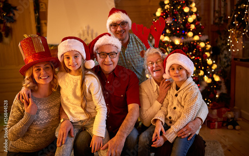 Happy family with gifts at xmas.