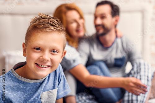 Happy family of three at home