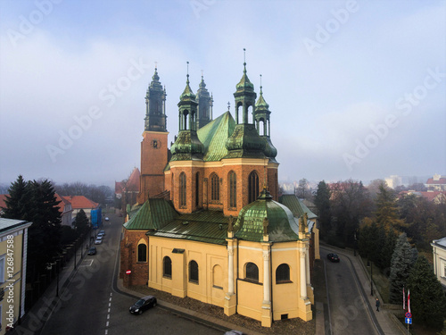The Archcathedral Basilica of St. Peter and St. Paull in polish city Poznan Ostrow Tumski square.Aerial view, foggy day