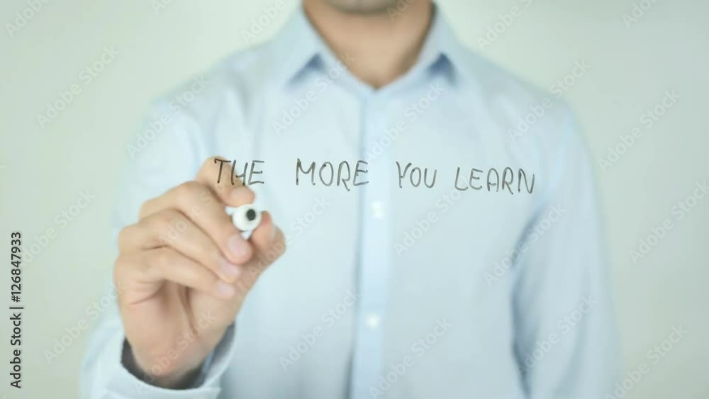The More you Learn The More you Earn, Man Writing on Screen The More you Learn The More you Earn, Man Writing on Screen