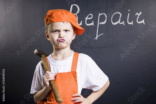 boy builder makes repairs photo