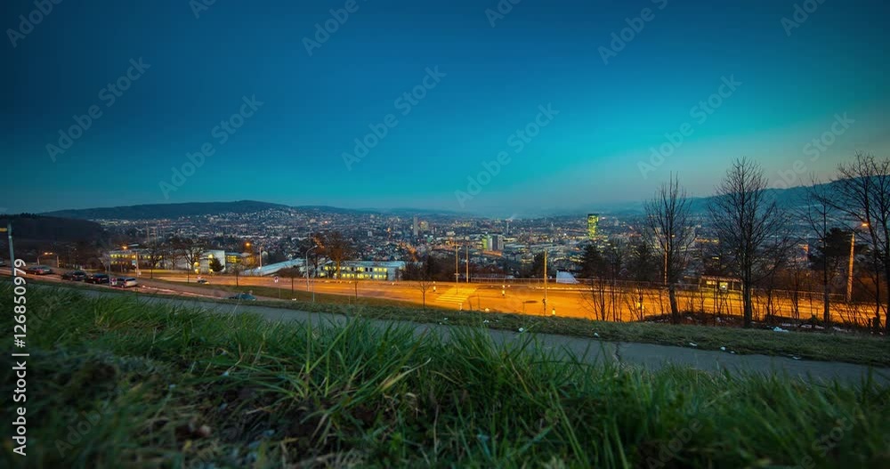 Zurich, Switzerland - View from Waid about the illuminated Zurich from sunset to night - Timelapse without motion 