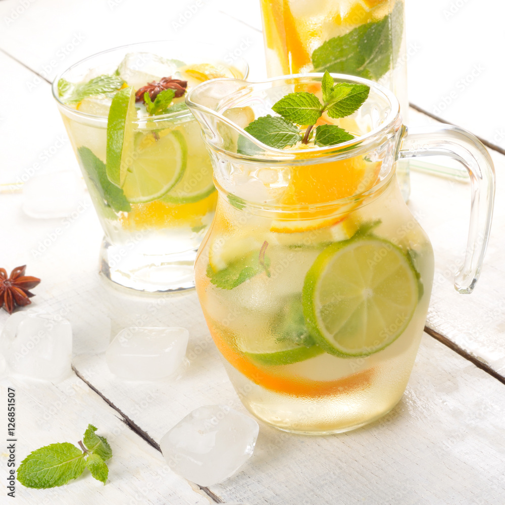 Jug with Lime and Orange Fruit Water with ice Jug with Lime and Orange Fruit Water with ice
