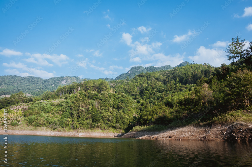 The lake and mountains scenery with blue sky The lake and mountains scenery with blue sky