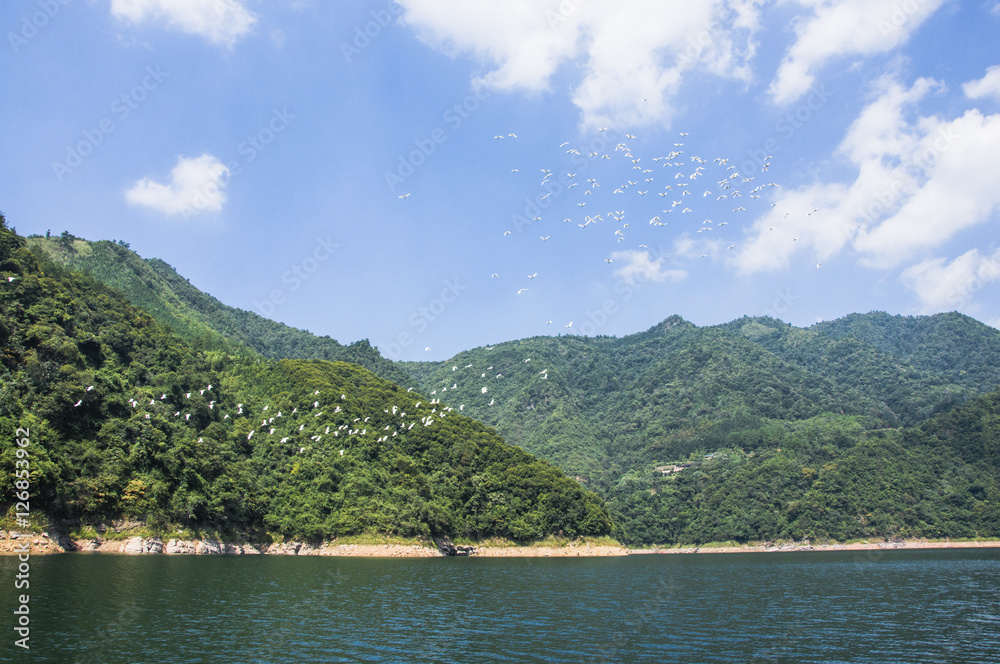 The lake and mountains scenery with blue sky The lake and mountains scenery with blue sky