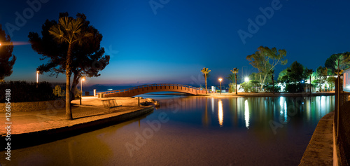 Bridge over the canal at night on the island of Mallorca photo