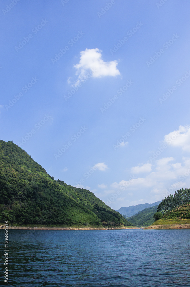 The lake and mountains scenery with blue sky The lake and mountains scenery with blue sky