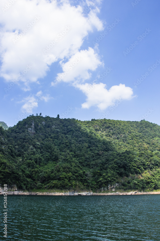 The lake and mountains scenery with blue sky The lake and mountains scenery with blue sky