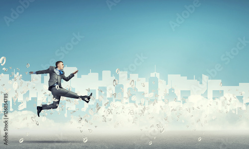 Businessman jumping high