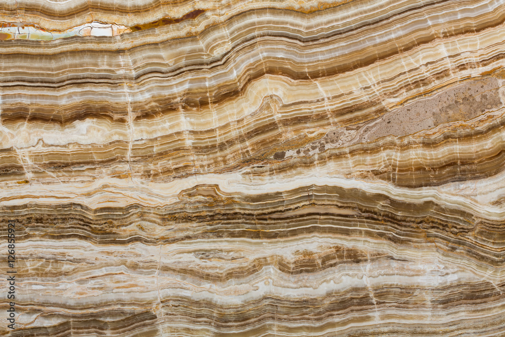 Naklejka premium Onyx texture of natural stone, brown background.