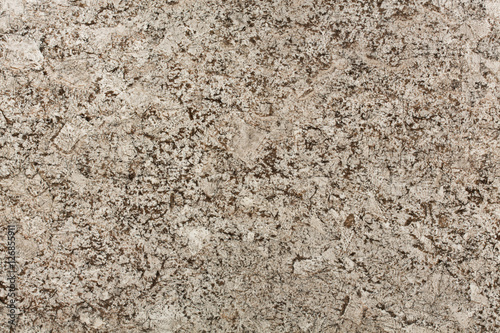 Beige and brown granite surface texture.