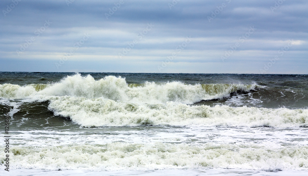 Storm. Big waves at sea near the beach