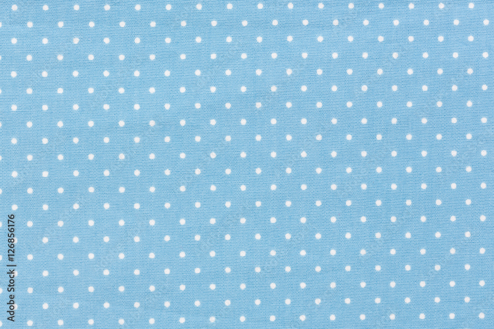 Seamless blue polka dot background pattern.