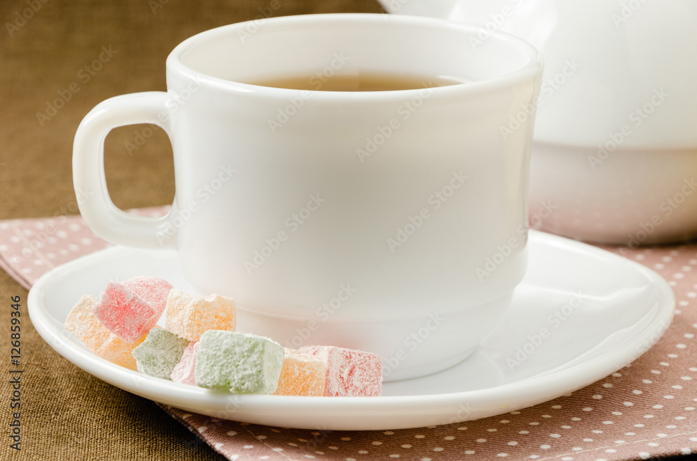 Turkish delight with tea on a saucer Turkish delight with tea on a saucer
