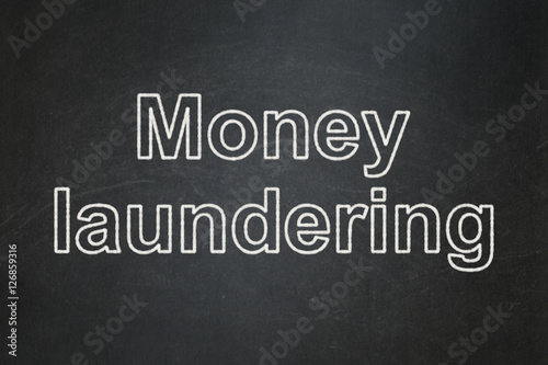 Money concept: Money Laundering on chalkboard background