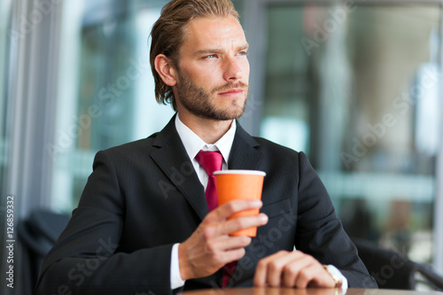 Portrait of a businessman drinking a cup of coffee