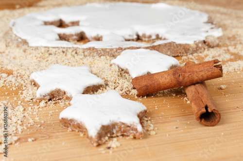 Making self-made christmas star cinnamon cookie, closeup, low focus