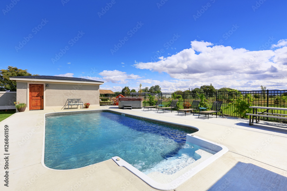 Fototapeta premium Swimming pool at the back yard of luxury house