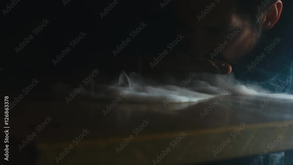 CU young Caucasian showing tricks with a smoke from a fragrant oriental hookah. 4K UHD RAW edited footage