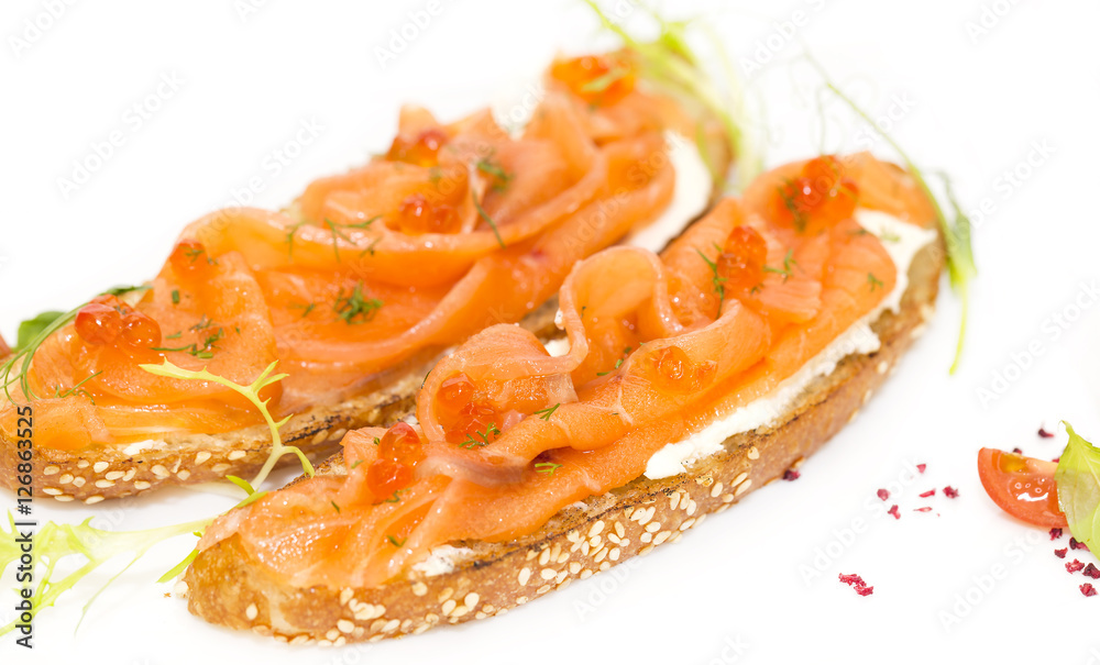 Sandwiches with salmon caviar and greens adorned
Sandwiches with salmon caviar and greens adorned