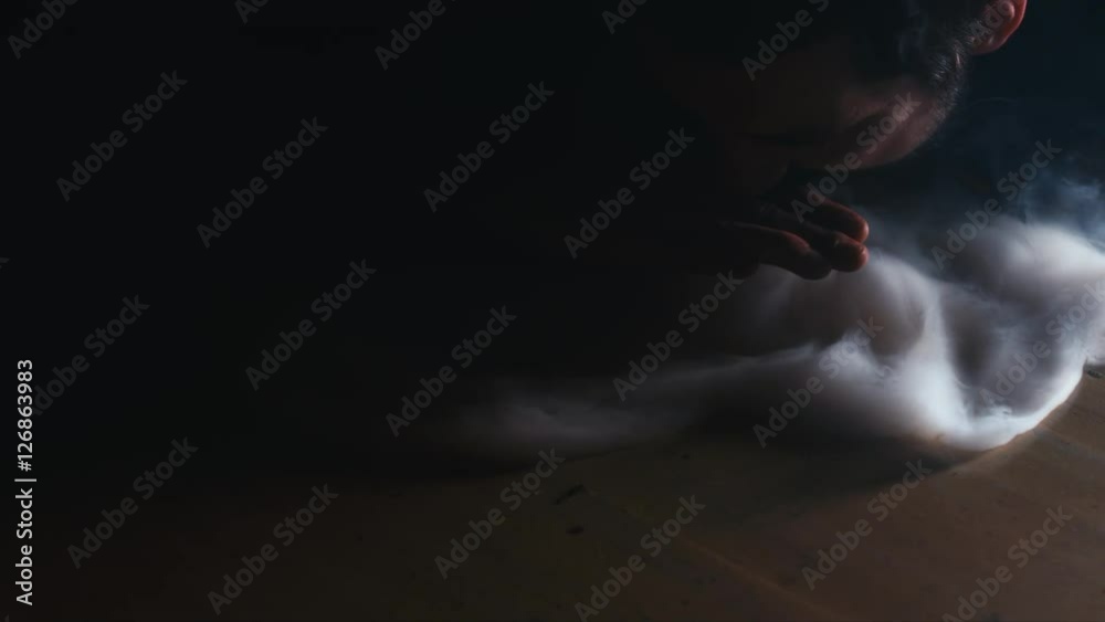 CU young Caucasian showing tricks with a smoke from a fragrant oriental hookah. 4K UHD RAW edited footage