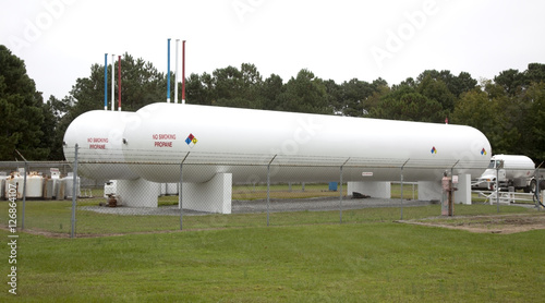 Bild auf Leinwand Propane Tanks in a Field