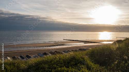 Fototapeta Naklejka Na Ścianę i Meble -  Sunset on a beach, shot from a dike