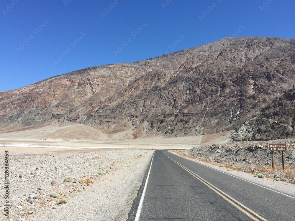 Highway in Death Valley with Badwater Basin signpost