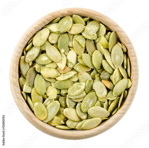 pumpkin seeds in bowl isolated