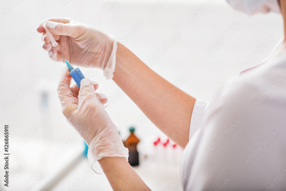 Skillful doctor working with human blood Skillful doctor working with human blood