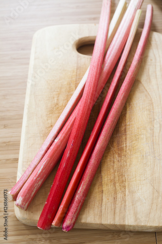 bunch of rhubarb on a wooden board