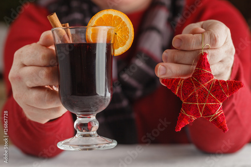Mulled wine with addition of an orange, honey, cinnamon, a carna photo