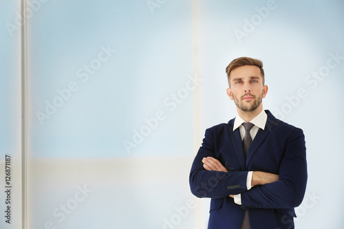 Young businessman on light ...