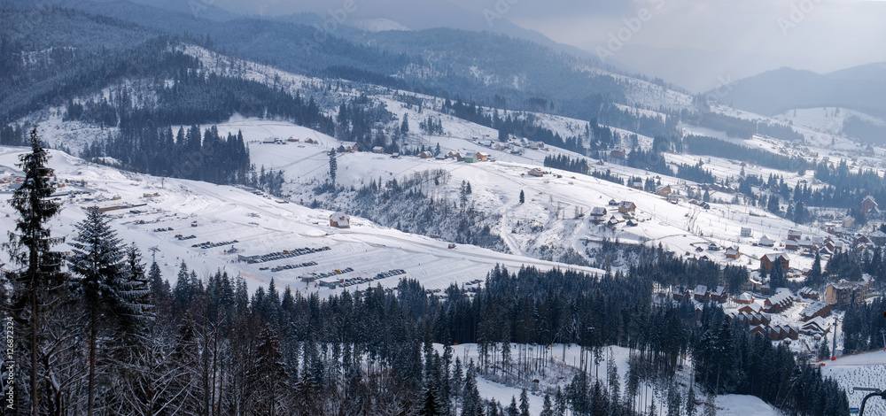 Mountain vilage winter landscape. Carpathian mountains covered w
