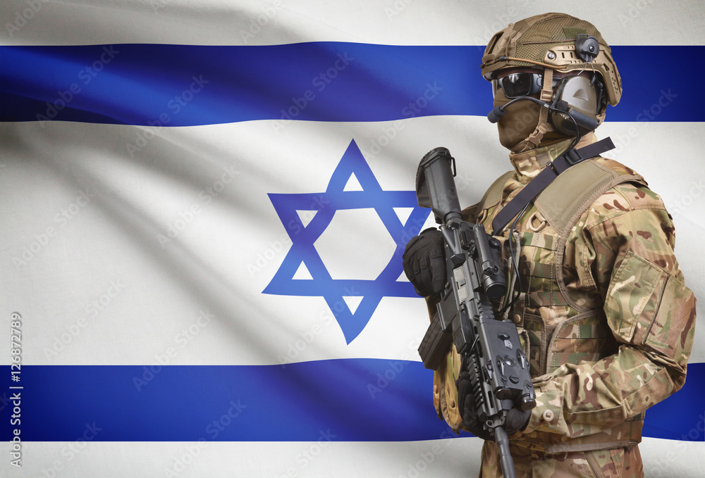 Soldier in helmet holding machine gun with flag on background series - Israel
