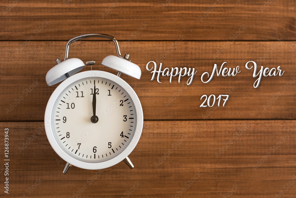 Happy New Year 2017 - greeting card design with retro clock on wooden background Happy New Year 2017 - greeting card design with retro clock on wooden background