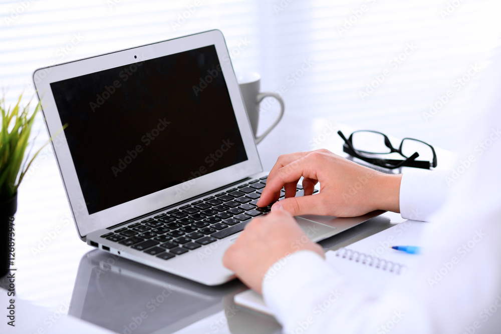 Close-up of Business woman is typing on laptop computer Close-up of Business woman is typing on laptop computer