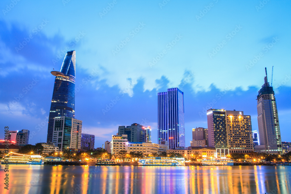 Night view of Downtown center of Ho Chi Minh city on Saigon riverbank in twilight, Vietnam.
