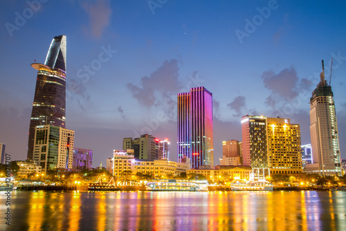 Night view of Downtown center of Ho Chi Minh city on Saigon riverbank in twilight  Vietnam.  