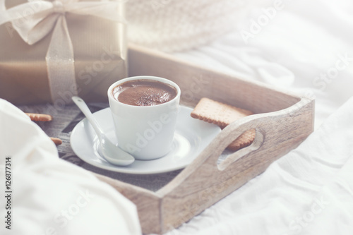Romantic breakfast with coffee, cookies, gift box and red plush