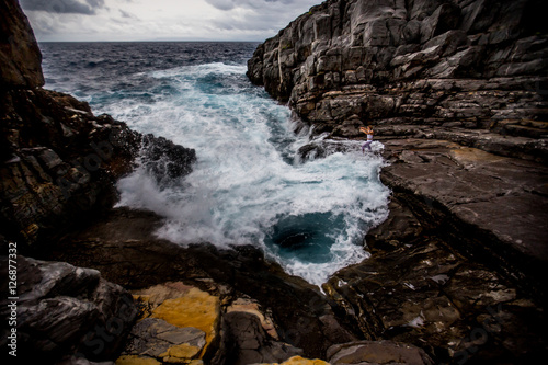 waves crashing on rocks