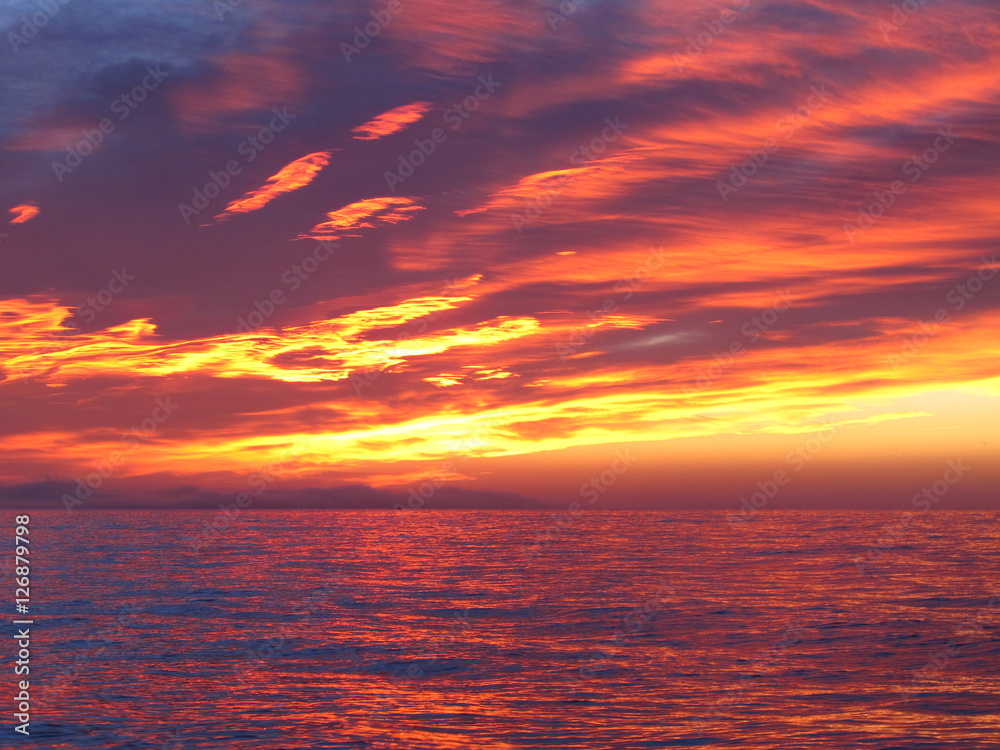 Colorful sunrise with clouds over the sea 2