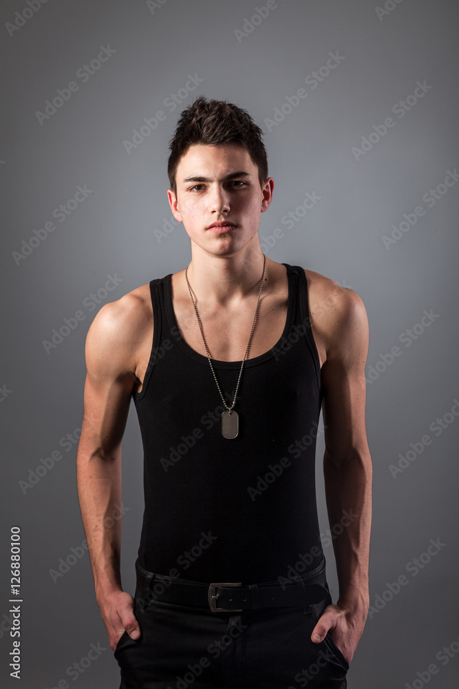 Fototapeta premium Muscular built man with a dog tags.