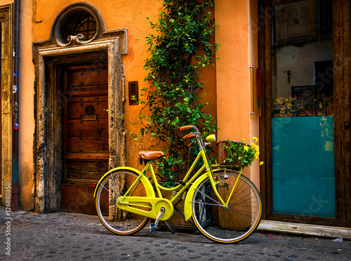 Fototapeta Naklejka Na Ścianę i Meble -  Bicycle parked on the street in Rome, Italy