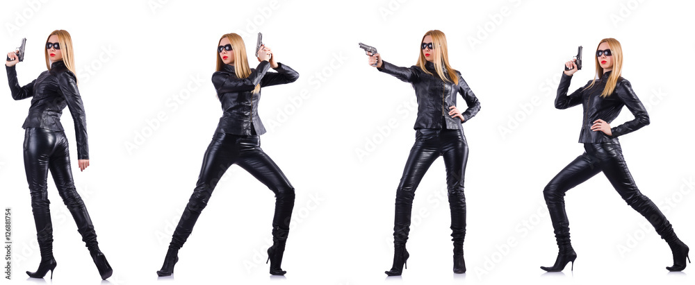Woman in leather costume with gun isolated on white Woman in leather costume with gun isolated on white
